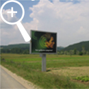 Photo 16: Billboard in a field.