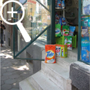 Photo 23: Boxes of detergent on shop steps.