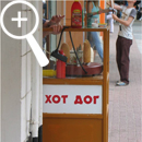 Photo 6: Small, brown food kiosk.