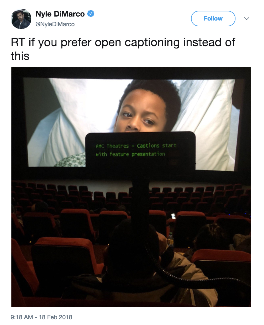 A movie theatre with captioning device displayed
