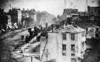 Daguerre, Louis. Boulevard du Temple. 1838, daguerreotype. A French street scene from above.